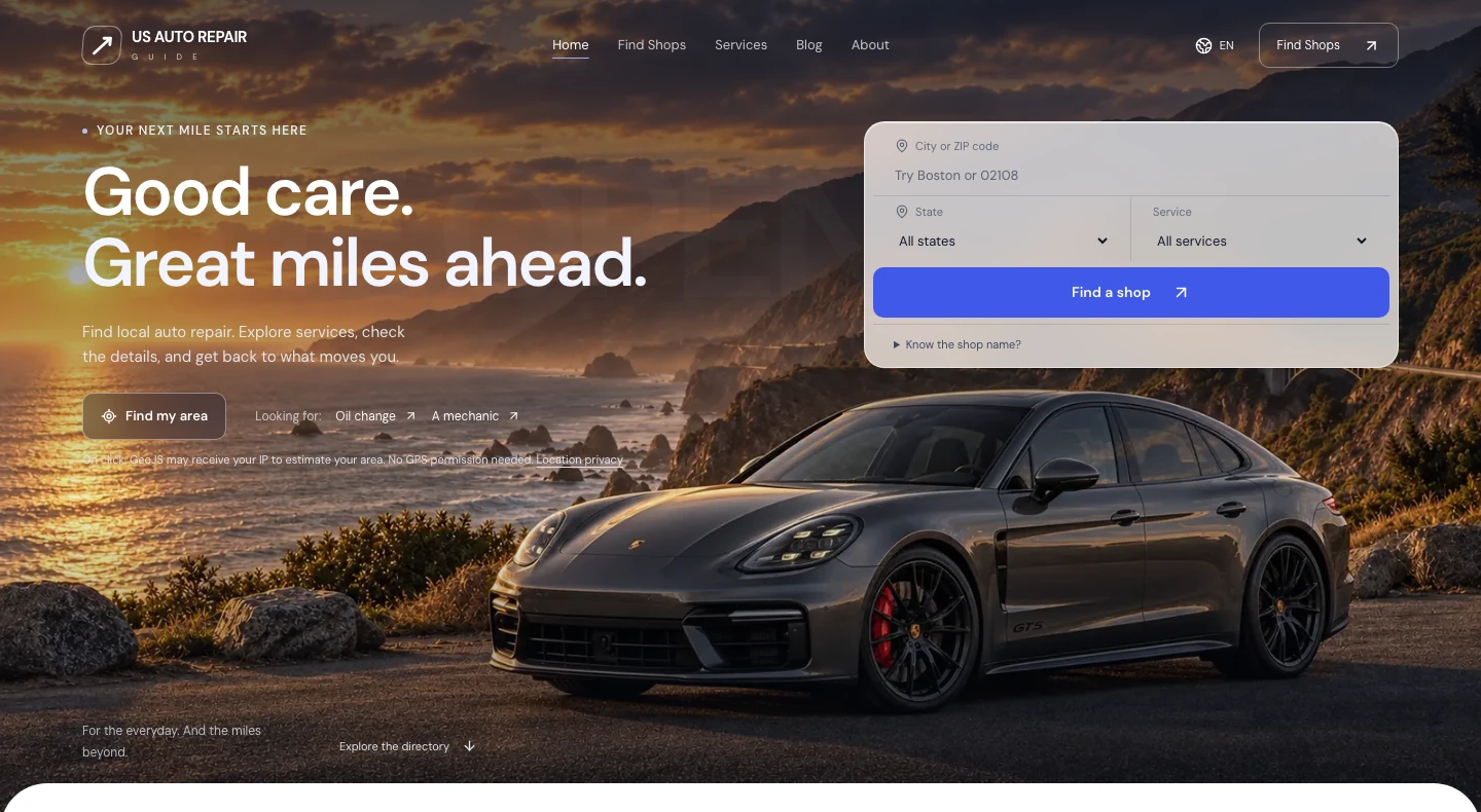 US Auto Repair Guide homepage with city, state and service search over a coastal road scene